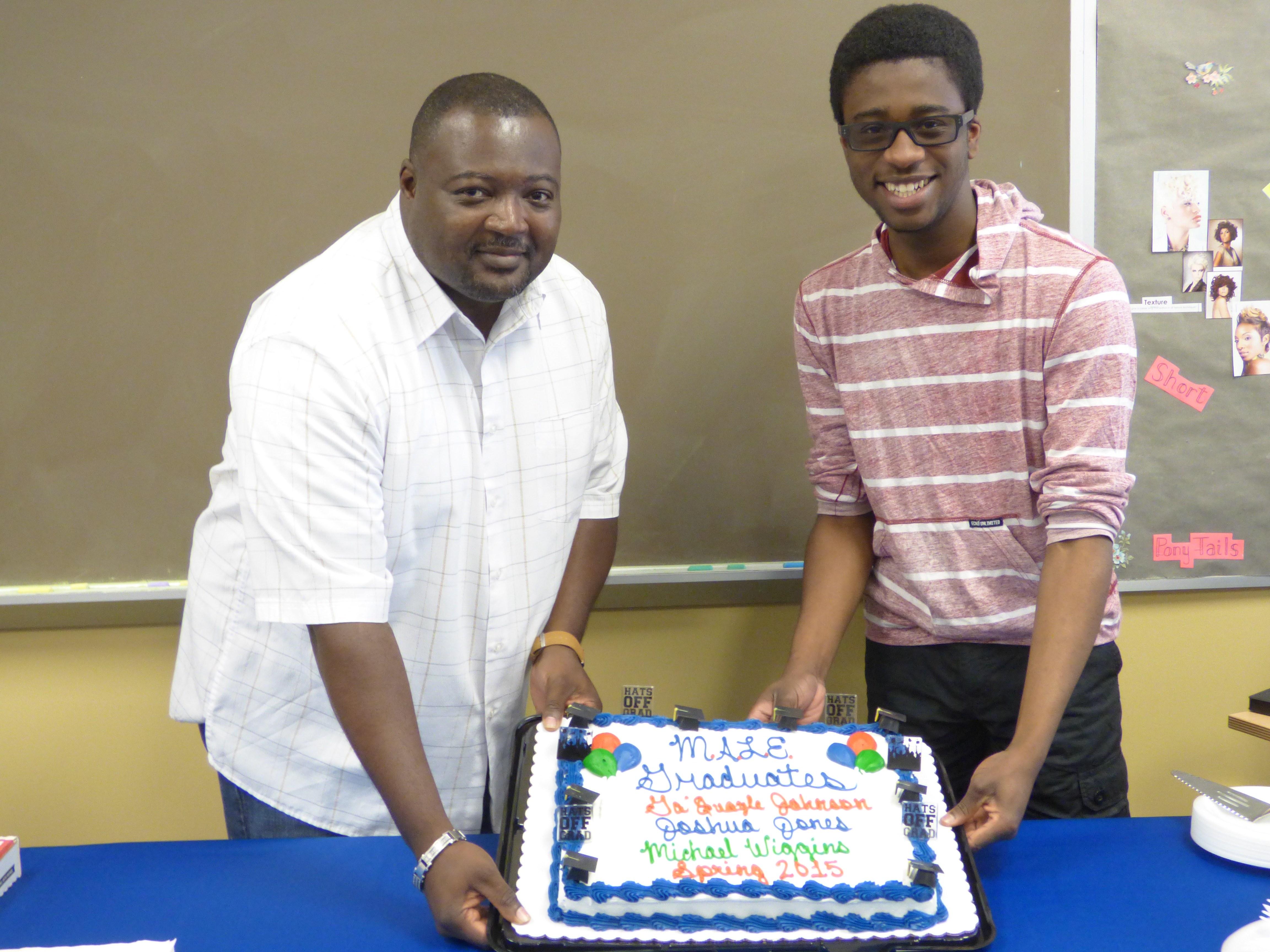 Michael Wiggins, left, and Joshua Jones, right, celebrate graduation from NCC. The two, along with Ga'Quayle Johnson, not pictured, are transferring to universities upon their graduation from NCC.