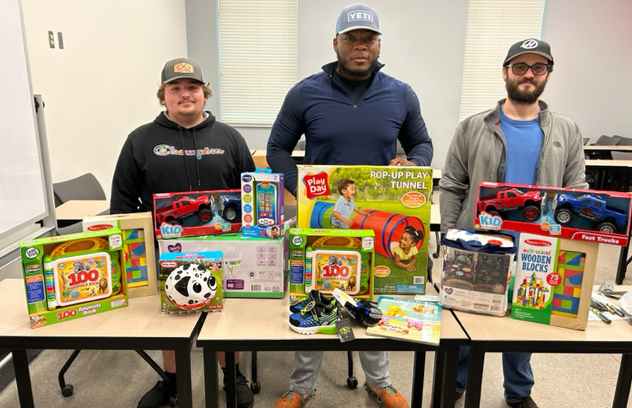 advanced manufacturing students shop for children in need