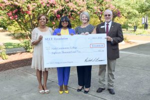 scholarship check presentation from SECU to NCC of $18,000