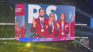NCC SkillsUSA Chapter Competitors and Advisor, Wanda Tyson, on stage at Nationals for Model of Excellence Presentation